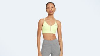 A photo of a woman wearing the Nike Dri Fit Indy sports bra, one of the best low-impact sports bras for women