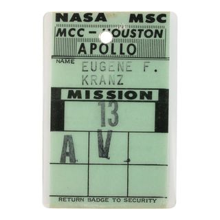 Flight director Gene Kranz's Mission Control Center access badge that he wore for the Apollo 13 mission is now open for bids with almost 80 other Apollo 13 artifacts and collectibles.
