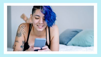 woman texting in bed