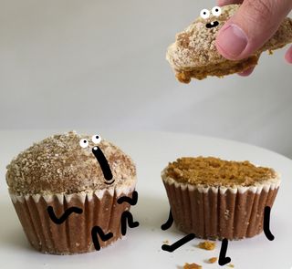 two cupcakes characters, one about to be eaten