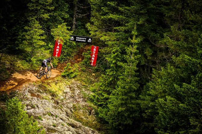 A rider enters an enduro section