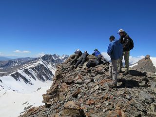 A Biosphere group Scouring the landscape for signs of a snow leopard