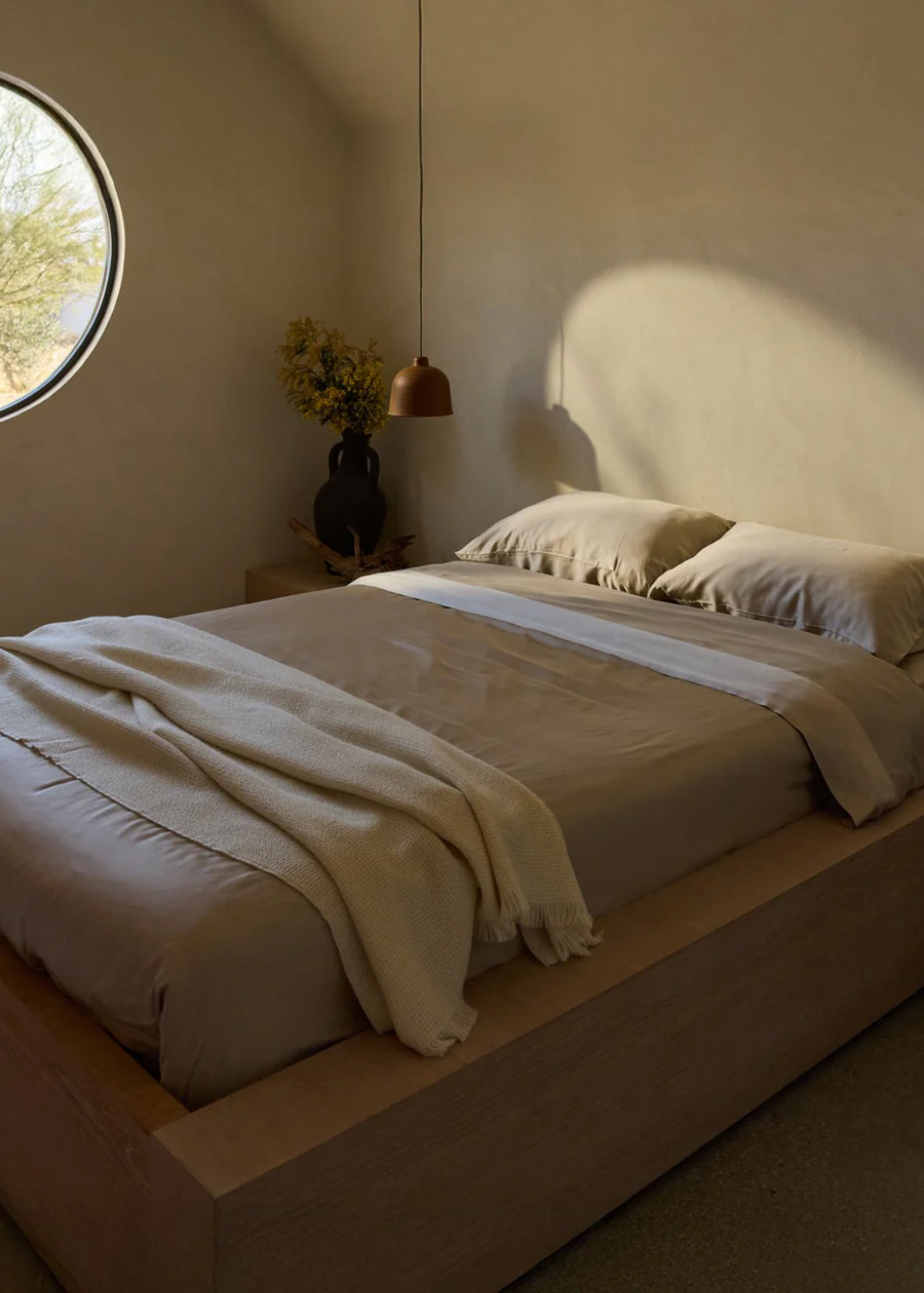 A minimalist bedroom with bamboo bedding