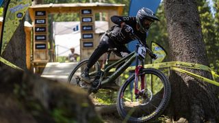 Sam Blenkinsop exits the start gate on his Norco downhill mountain bike