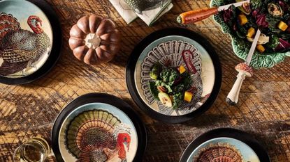 close-up of thanksgiving table with colorful plates 