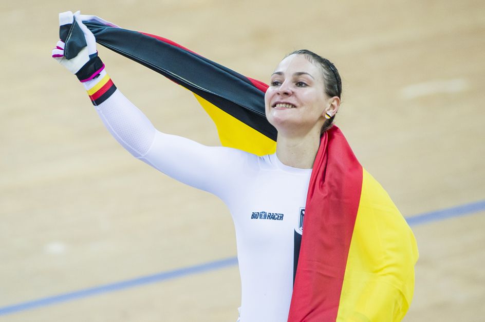 Kristina Vogel celebrates a third keirin world title