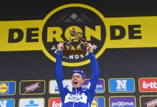 Niki Terpstra celebrates on the podium after winning Tour of Flanders