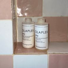 Olaplex Shampoo and Conditioner shot on Katie's shower shelf