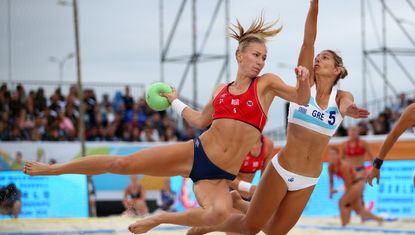  Martinsen Marielle Elisabeth Mathisen (l) of Norway plays a shot during 2018 Women&#039;s Beach Handball World Cup final against Kaloidi Anna Polyxeni of Greece on July 29, 2018 in Kazan, Russia.