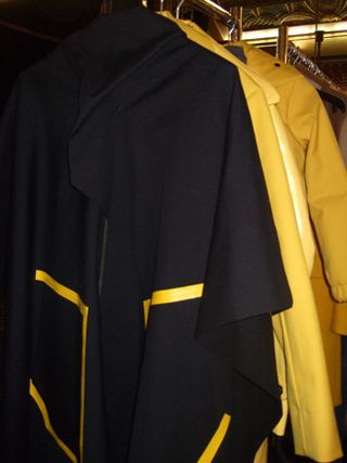 A big cape for boys made from heavy, waxed cotton, finished with bright-coloured tape. G-Star also used this technique for trousers in dark denim,