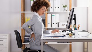 women-low-back-pain-desk