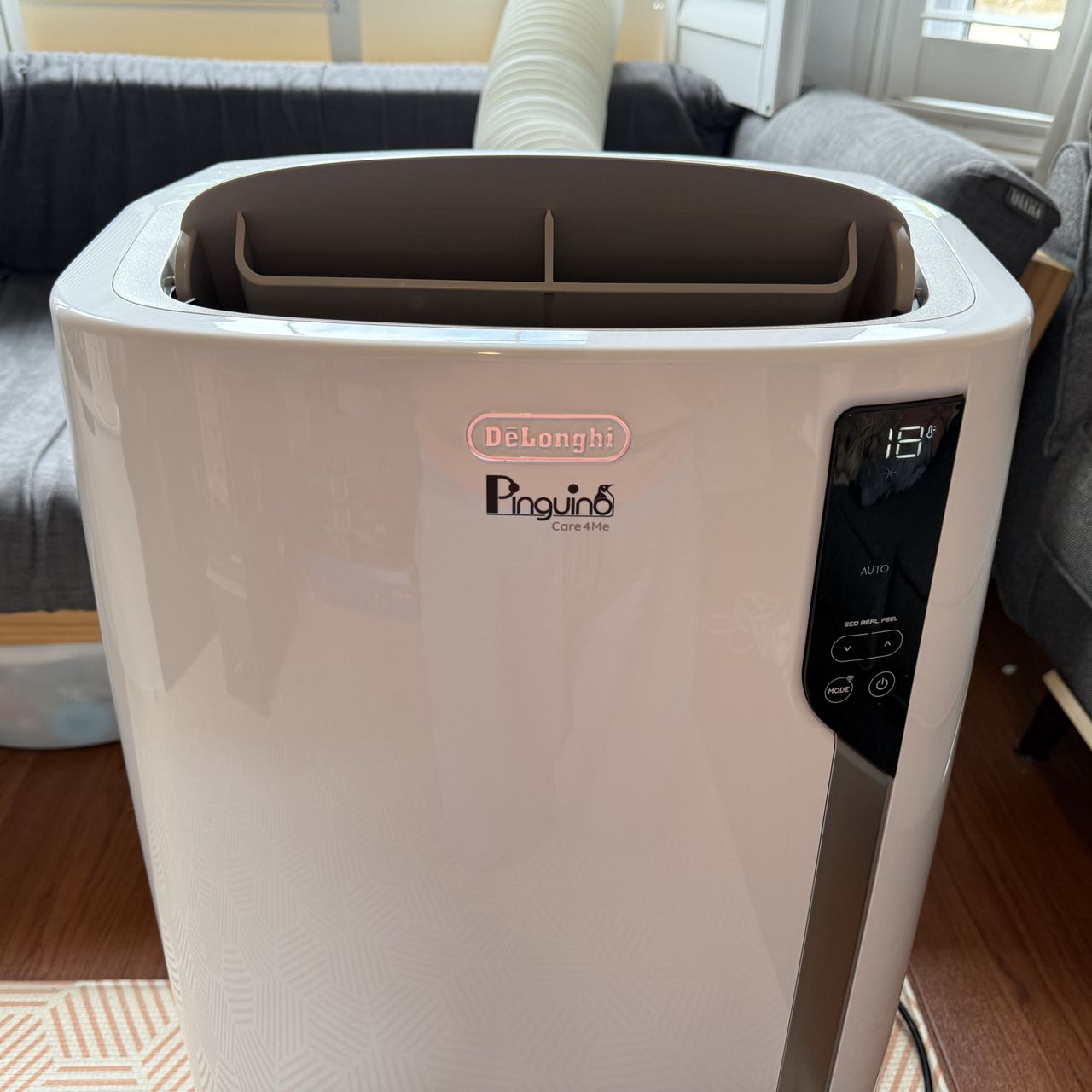 delonghi pinguino care4me portable air conditioner switched on in a living room