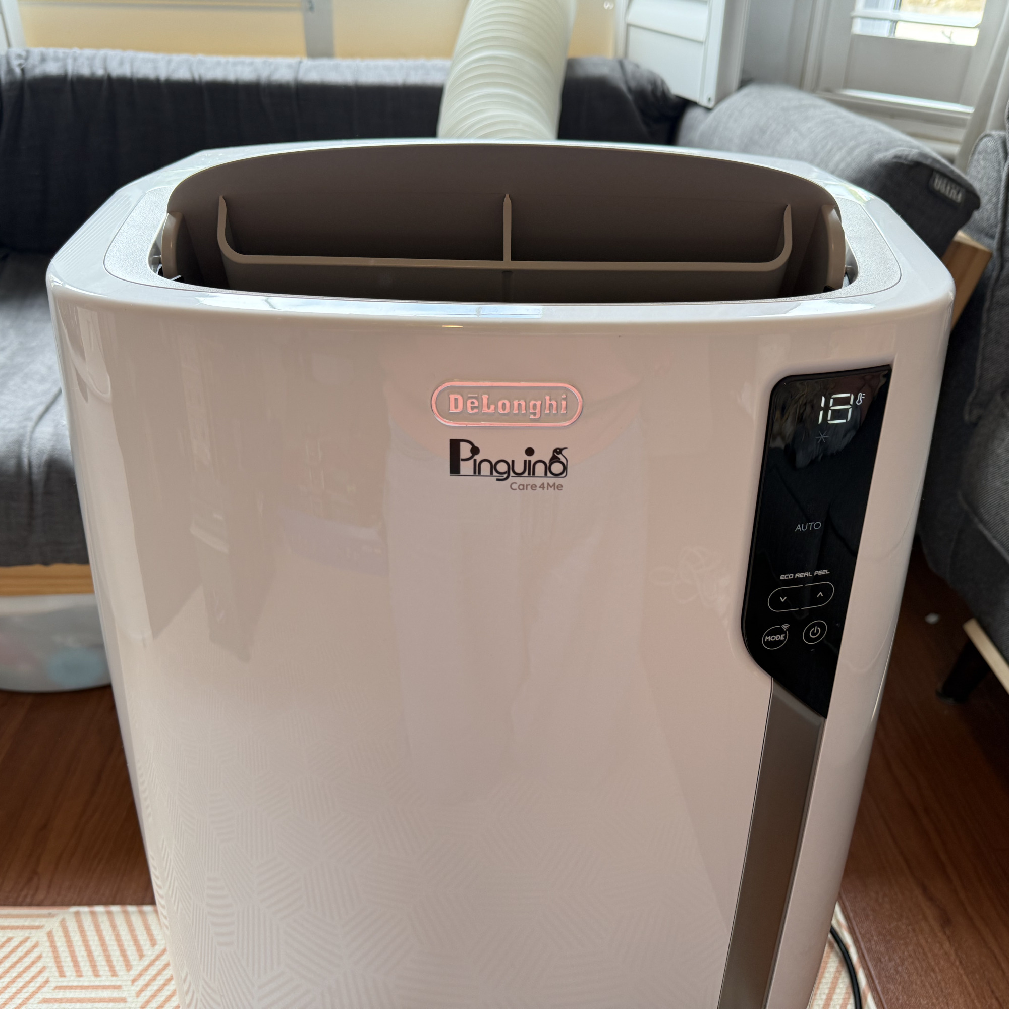 delonghi pinguino care4me portable air conditioner switched on in a living room