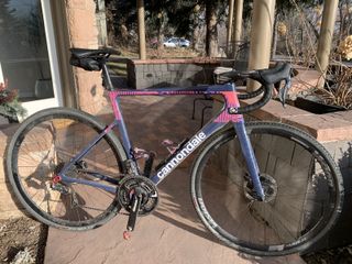 Lachlan Morton's Cannondale SuperSix Evo training bike modified with gravel tyres 