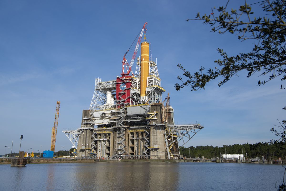 The core stage of NASA&#039;s first Space Launch System rocket, as seen on the test stand in Mississippi earlier this year.