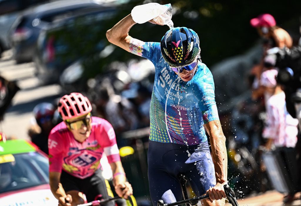 IsraelPremier Tech teams British rider Chris Froome cools down with water as he cycles the ascent of the Col de la Croix de Fer during the 12th stage of the 109th edition of the Tour de France cycling race 1651 km between Briancon and LAlpedHuez in the French Alps on July 14 2022 Photo by Marco BERTORELLO AFP Photo by MARCO BERTORELLOAFP via Getty Images