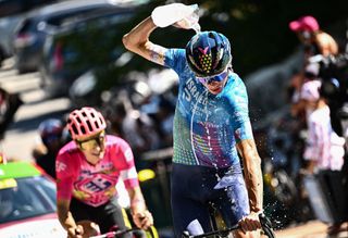 IsraelPremier Tech teams British rider Chris Froome cools down with water as he cycles the ascent of the Col de la Croix de Fer during the 12th stage of the 109th edition of the Tour de France cycling race 1651 km between Briancon and LAlpedHuez in the French Alps on July 14 2022 Photo by Marco BERTORELLO AFP Photo by MARCO BERTORELLOAFP via Getty Images