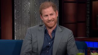 Prince Harry smiling on the Stephen Colbert's Show