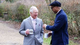 Jay Blades greets King Charles III with a cup of tea in The Repair Shop