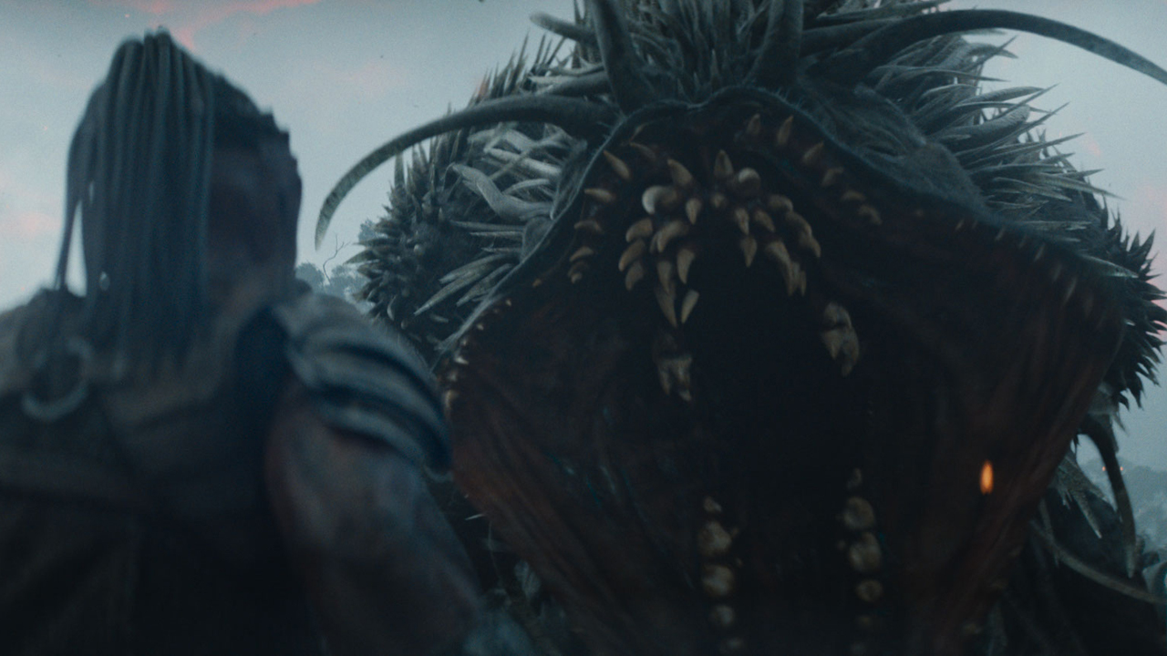 Dek faces off with a monster in Predator: Badlands