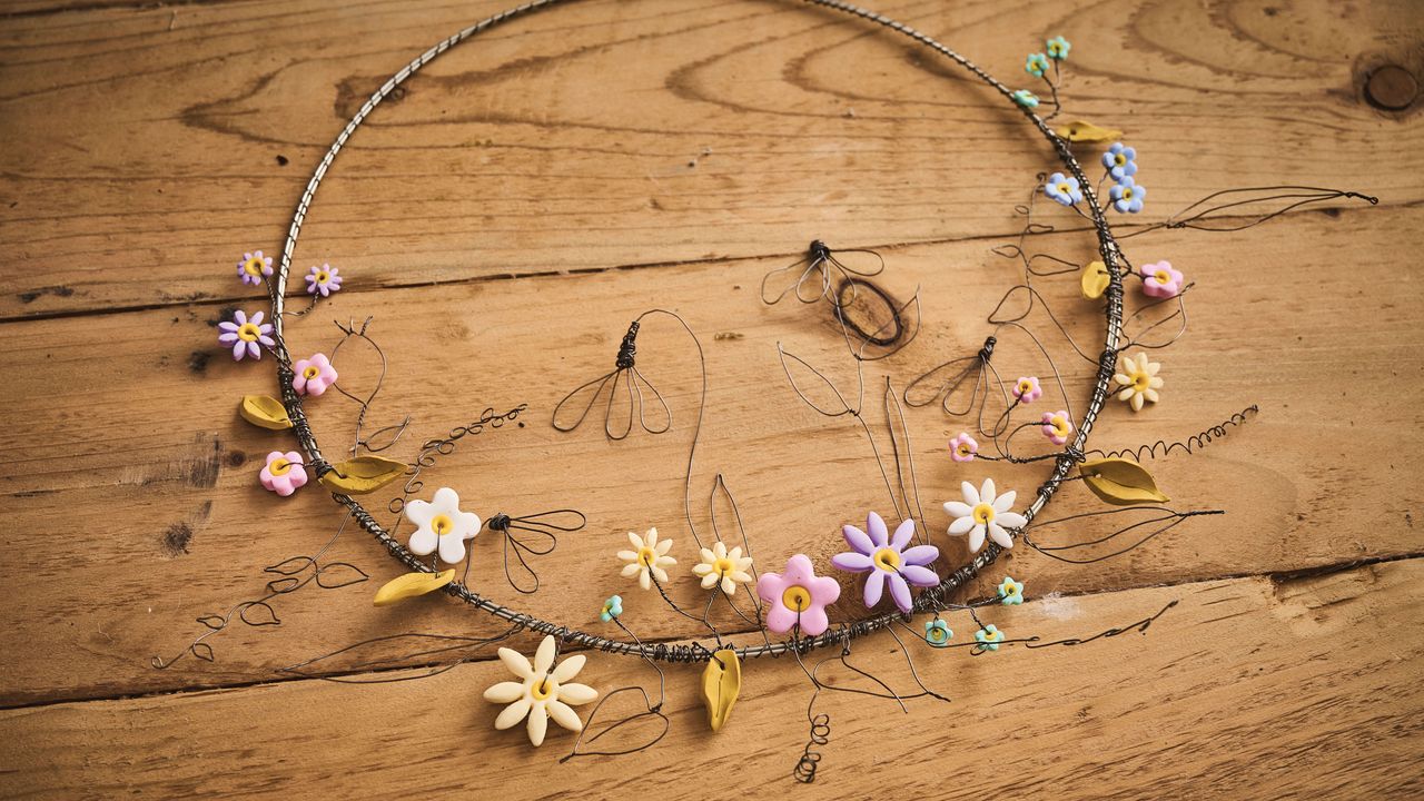 Wire spring wreath with polymer flowers