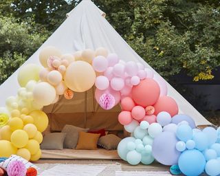 colourful balloon arch and tepee