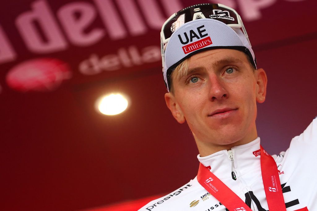 Team UAE&#039;s Slovenian rider Tadej Pogacar celebrates on the podium after winning the 2nd stage of the 107th Giro d&#039;Italia cycling race, 161km between San Francesco al Campo and Sanctuary of Oropa (Biella), on May 5, 2024 in Biella. (Photo by Luca Bettini / AFP)