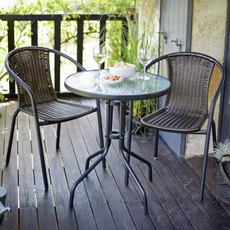 Argos Home 2 Seater Rattan Effect Garden Bistro Set in brown on a wooden veranda.