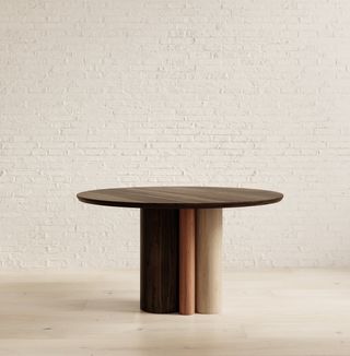 timber dining table with white brick backdrop