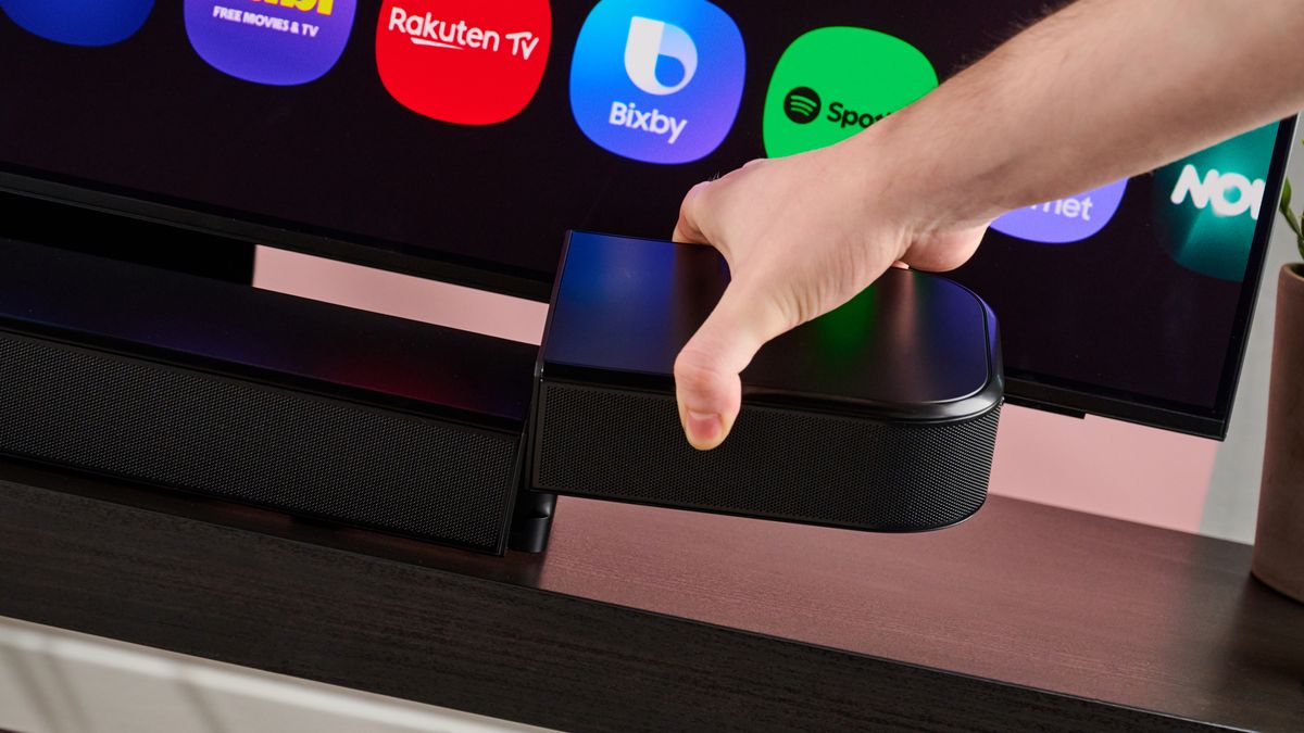 Man attaching surround speaker to the JBL Bar 800MK2