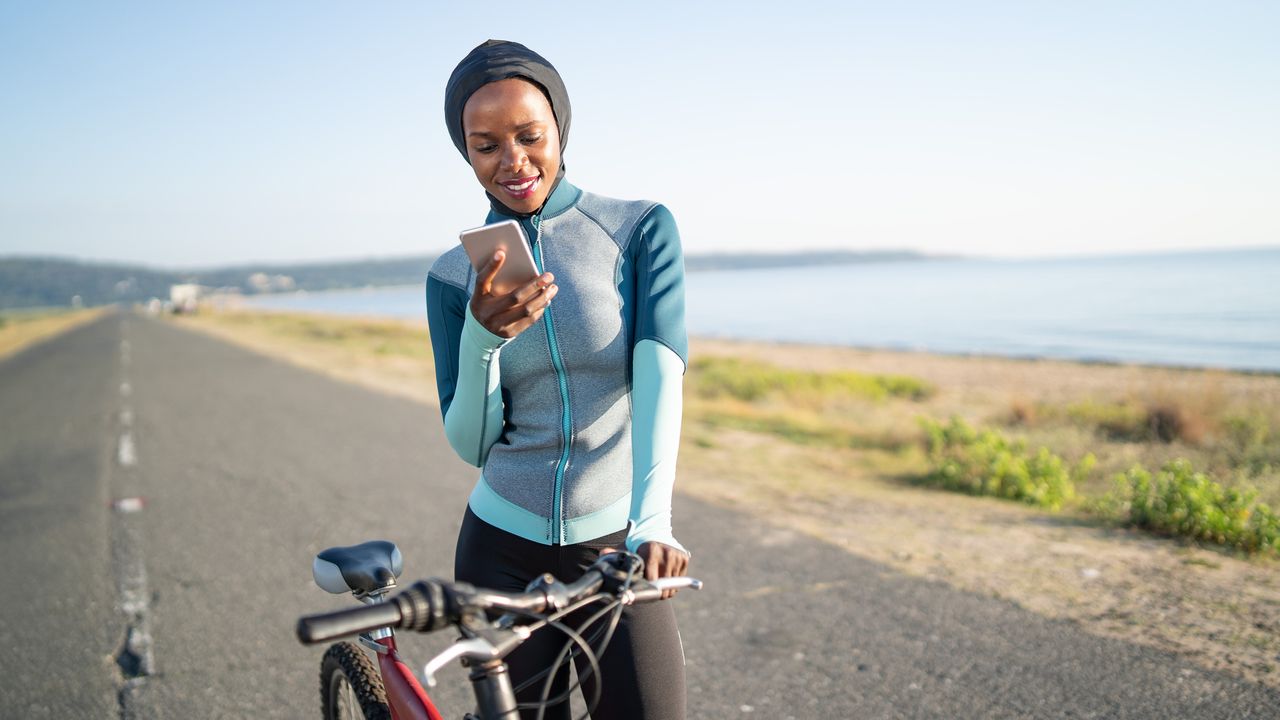 A woman on a spin bike working out if cycling is a good workout?