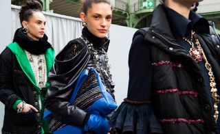 Chanel: Models wear black leather and puffer jackets with colourful accessories