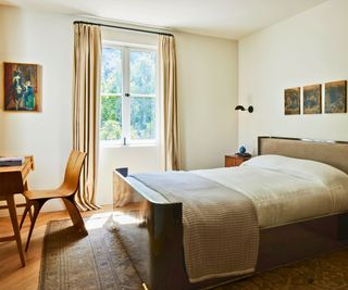 bedroom with wooden desk and chair