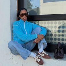 Claire Most in chocolate brown sneakers