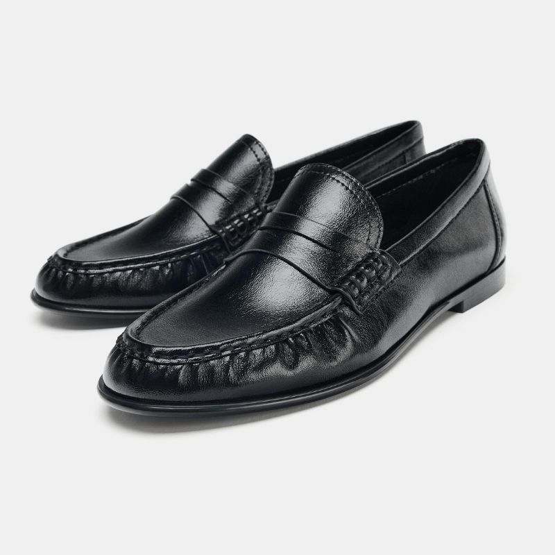 A pair of black gathered loafers by Zara