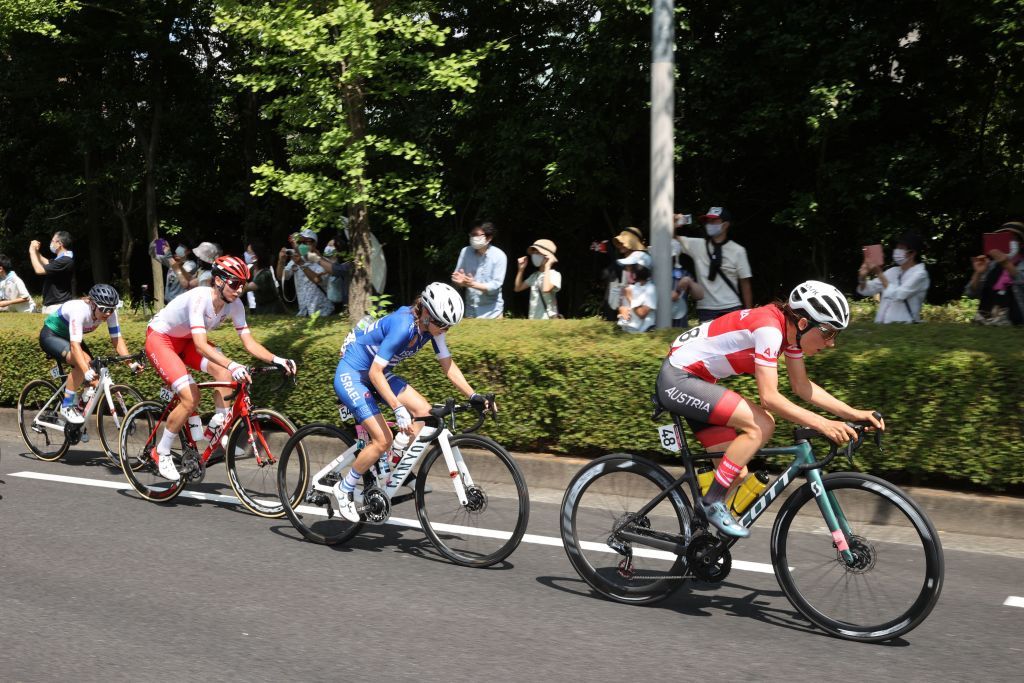 LR Austrias Anna Kiesenhofer Israels Omer Shapira Polands Anna Plichta and Namibias Vera Looser ride in a breakaway group as they lead the womens cycling road race of the Tokyo 2020 Olympic Games after the race start at Musashinonomori Park on the outskirts of Tokyo Japan on July 25 2021 Photo by MICHAEL STEELE POOL AFP Photo by MICHAEL STEELEPOOLAFP via Getty Images