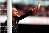 Chelsea goalkeeper Robert Sanchez gestures to give instructions to his defenders during the Premier League match against Arsenal at Emirates Stadium in London, England on 16 March, 2025.
