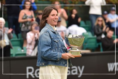 a close up of pregnant Johanna Konta holding a trophy at a Eastbourne tennis competition