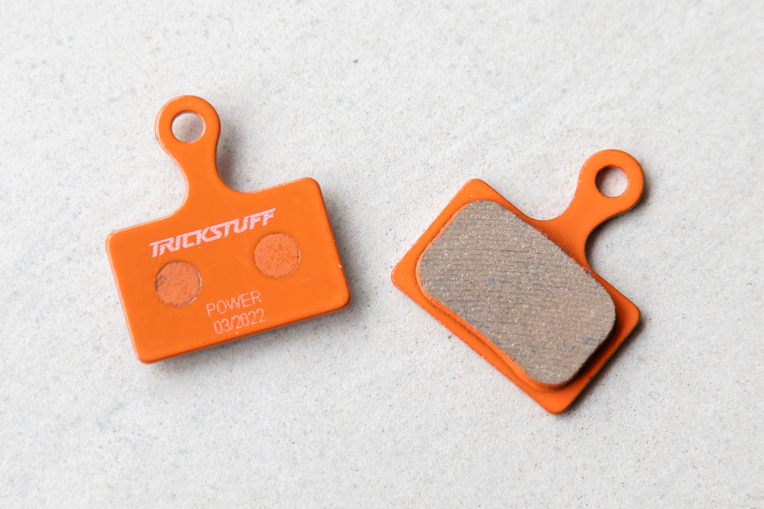 Trickstuff Power Disc Brake Pads, with a distinctive bright orange backing.