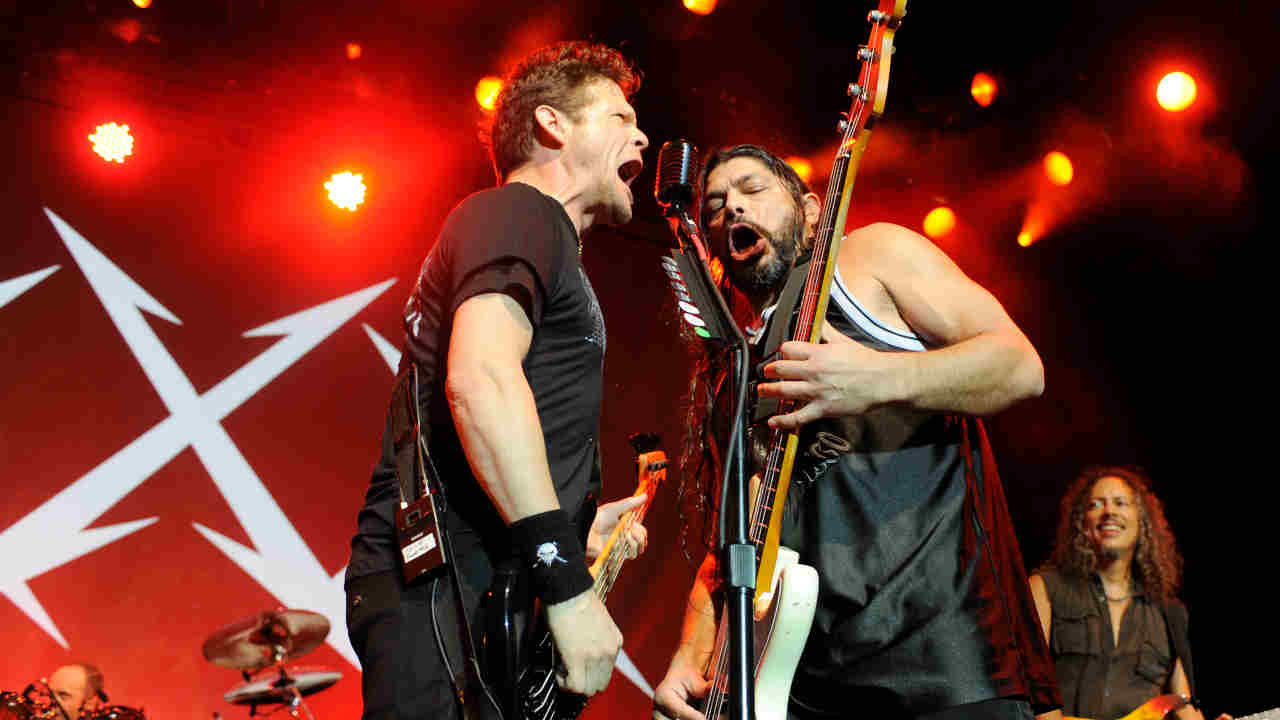 Jason Newsted and Rob Trujillo performing onstage in 2011