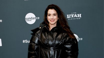 anne hathaway wearing puffer coat