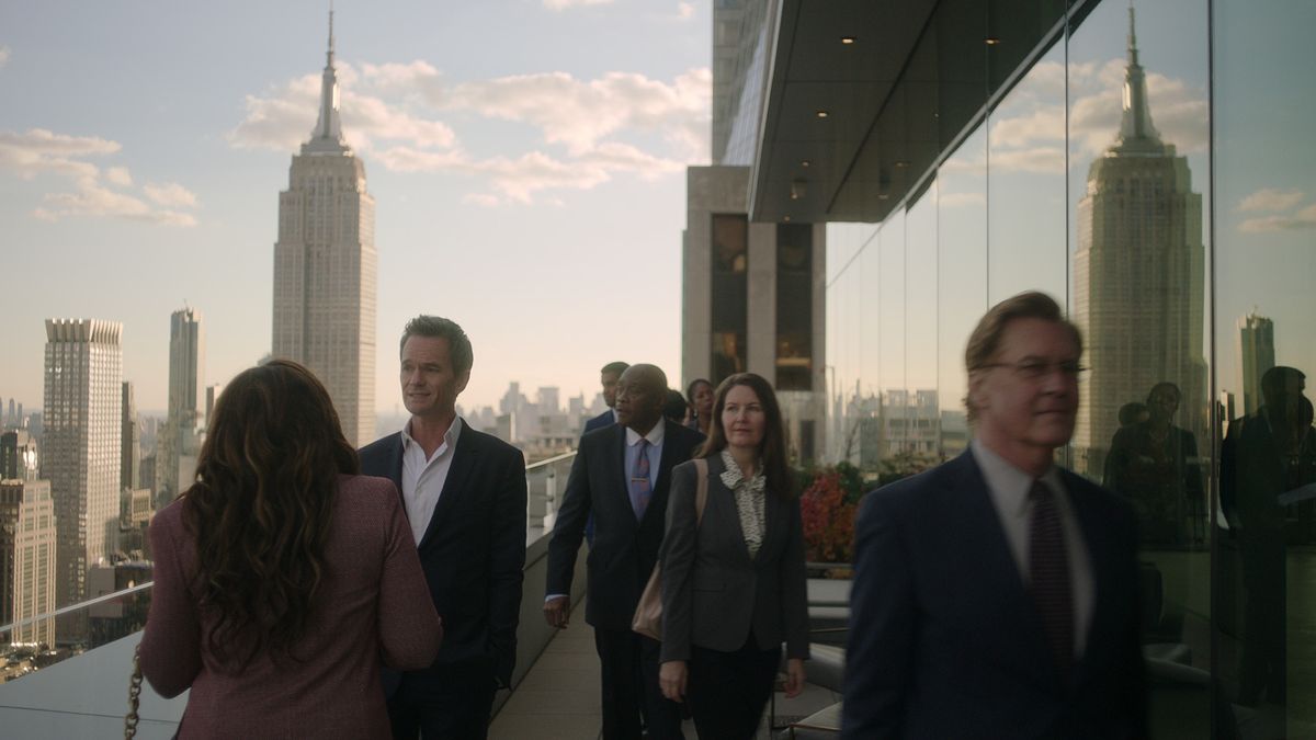 Uncoupled&#039;s Michael Lawson (Neil Patrick Harris) on a New York City balcony with the Empire State Building in the background.