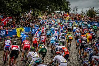 The men's peloton climbs the cobbles on Libby Hill during the 2015 UCI World Championship Road Race.