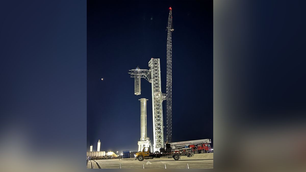 SpaceX CEO Elon Musk unveiled this view of the company's Starship SN20 prototype being attached to its Super Heavy booster near Boca Chica village in South Texas on Feb. 9, 2022 ahead of a project update.