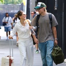 Millie Bobby Brown walks with her husband on her way to a helicopter in New York City