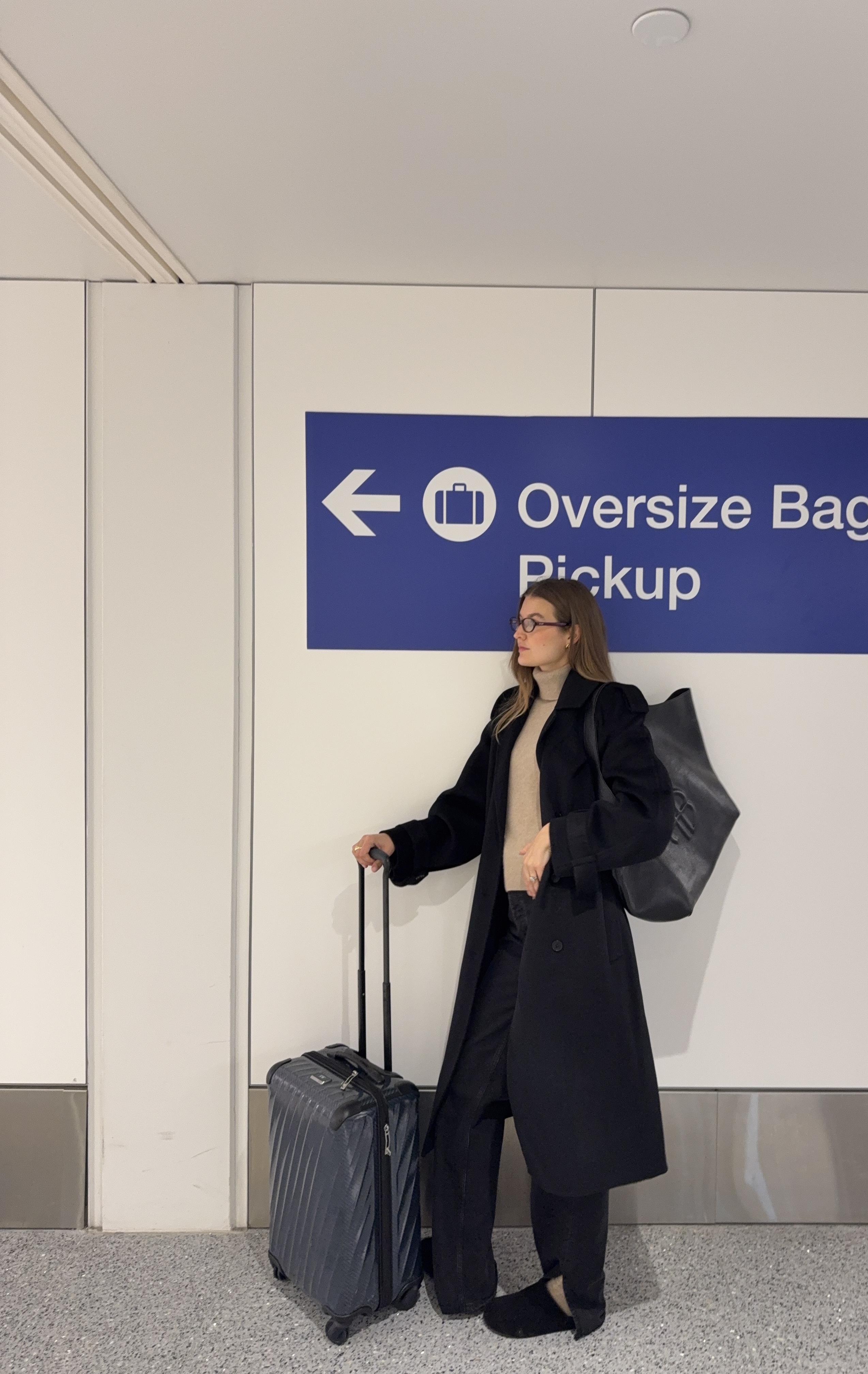 Sara Walker wearing jeans and a sweater.