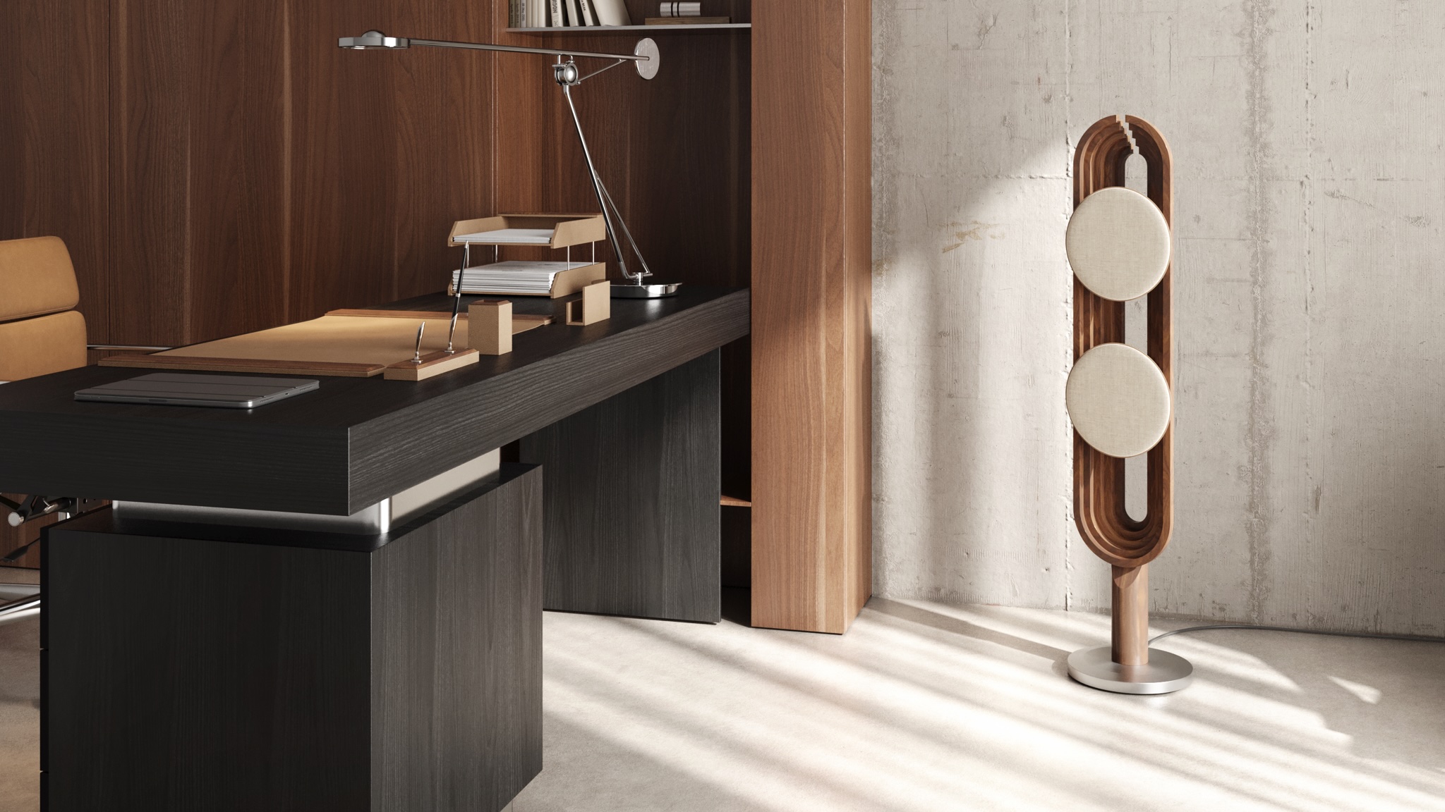 PENT. Audio Aurora speaker in an office with dark furniture