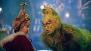 How the Grinch Stole Christmas -elokuvan tyttö ja vihreä hirviö keskustelemassa