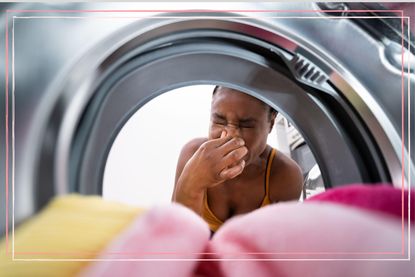 Women holding her nose and wondering 'why does my washing machine smell'