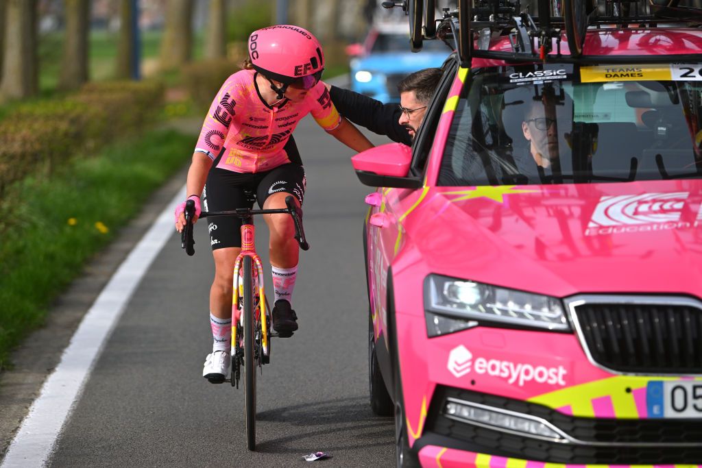 DE PANNE BELGIUM MARCH 21 Lotta Henttala of Filand and Team EF EducationCannondale assisted by the team car due to a shoe problem during the 7th Womens Classic BruggeDe Panne 2024 a 155km one day race from Brugge to De Panne on March 21 2024 in De Panne Belgium Photo by Luc ClaessenGetty Images